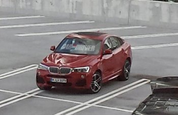 Новый BMW X6 замечен без маскировки во время рекламной съемки